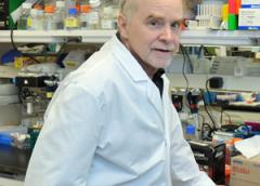 Photo of Dr. John O'Shea in the lab.