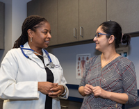 A woman talking to her health care provider