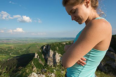 women standing at the top of a hill