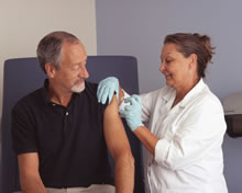 Photo of an older gentleman getting a flu shot